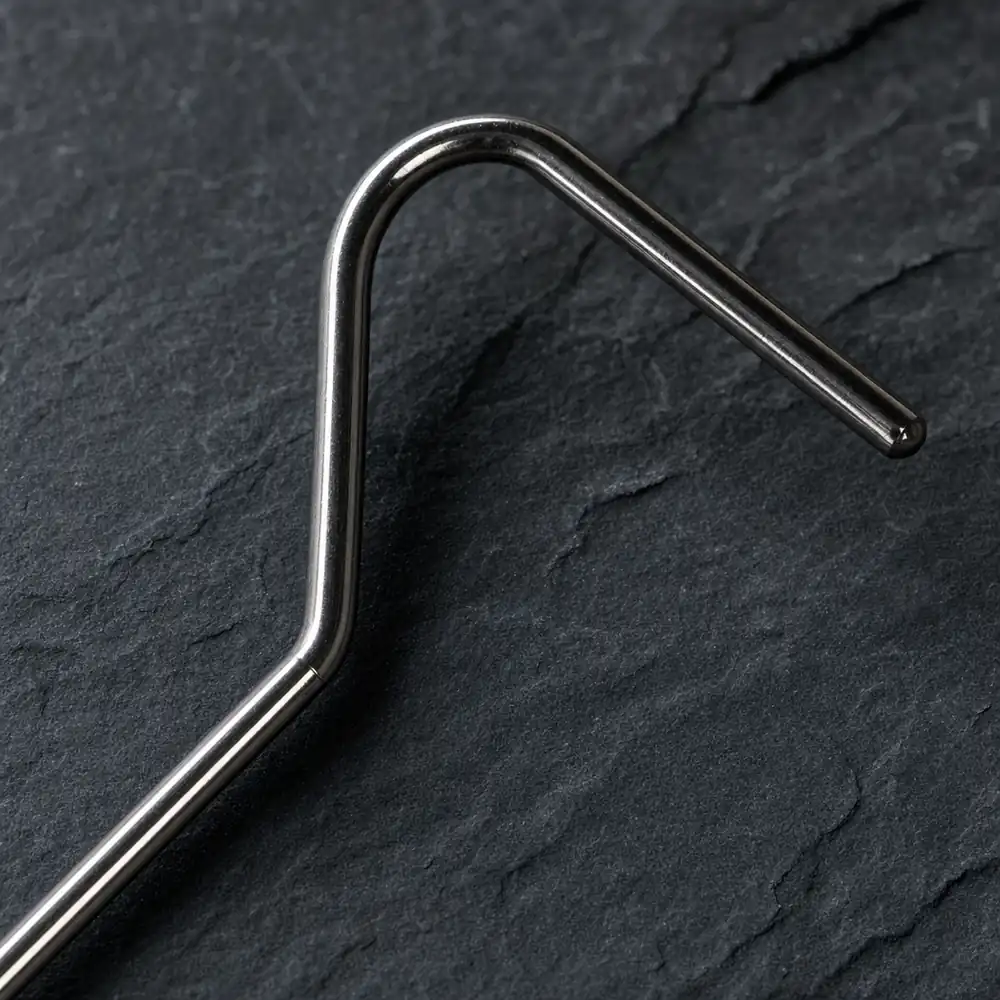 Close-up of the curved stainless head and the first telescoping section of the snake hook